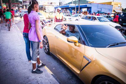 Bolt in his gold Nissan GT-R, a gift from one of the brands that sponsor him.