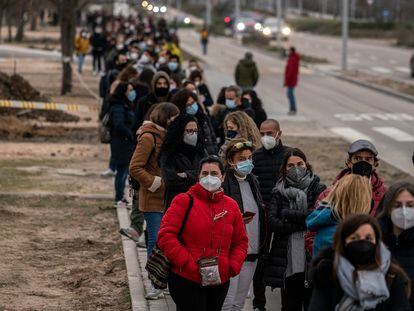 Hundreds of people await their turn for vaccination outside Isabel Zendal Hospital in Madrid on Monday.
