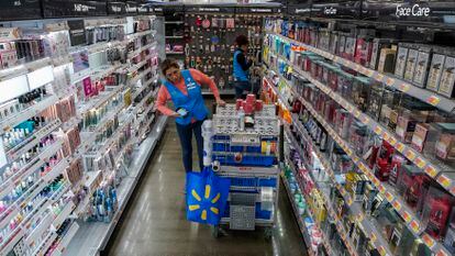 An employee organizes beauty products inside the Walmart Supercenter in North Bergen, N.J. on Thursday, Feb. 9, 2023.