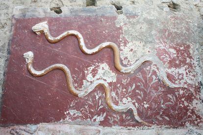 Two stucco snakes on the altar of the great Lararium found in Pompeii.