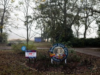 Signs stand in the garden, after the death of former US first lady Rosalynn Carter, in Plains, Georgia, U.S., November 20, 2023.