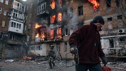 A local resident leaves his home after Russian shelling destroyed an apartment house in Bakhmut, Donetsk region.