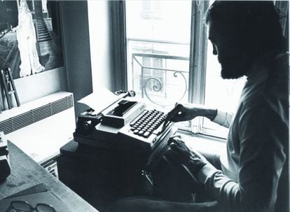 Julio Cortázar, sitting in front of his typewriter, in an undated image.