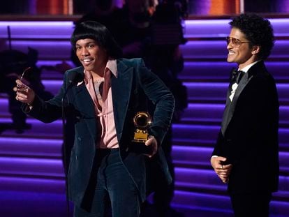 Anderson .Paak (l) and Bruno Mars, from Silk Sonic, accept a Grammy Award in Las Vegas.