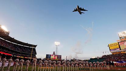 A C-17 Globemaster military aircraft flies over Angels Stadium in Anaheim during Opening Day celebrations in 2010.