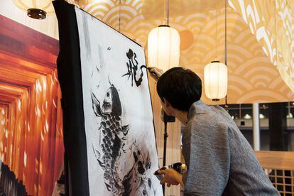'Sumie' is a Japanese monochromatic art form. An artist creates a work live at the Japanese stand.