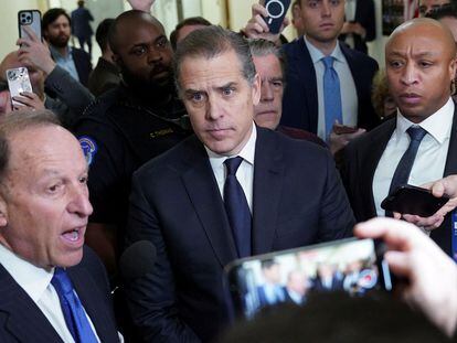Hunter Biden listens to his attorney Abbe Lowell as they depart following a surprise appearance at a House Oversight Committee on Capitol Hill in Washington. January 10, 2024.