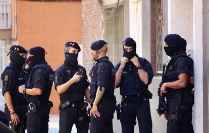 Mossos d’Esquadra officers on Monday outside the attacker’s apartment.