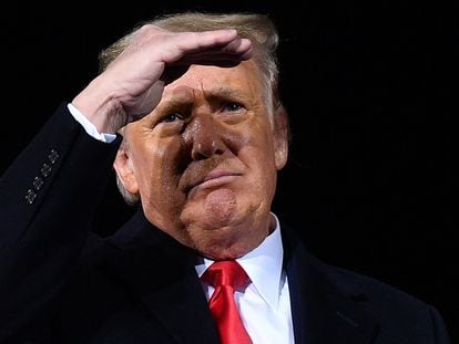 Then-president Donald Trump looks on during a rally in Dalton, Georgia, on January 4, 2021.