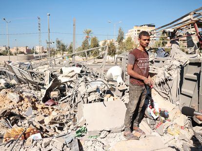 A Palestinian man amid the rubble from an Israeli airstrike in the Gaza Strip's Nuseirat area.