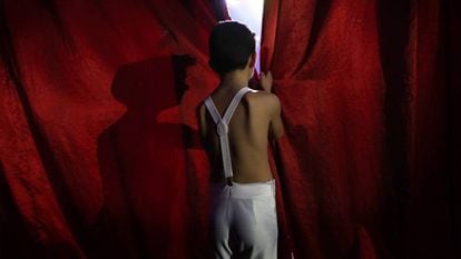 A child performer waits his turn to go into the ring at Gottani Circus.