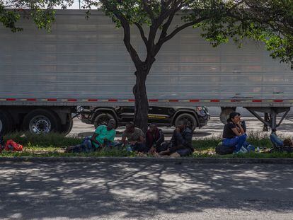 Migrants rest on a median in front of the Northern Bus Station in Mexico City, on September 22, 2023.