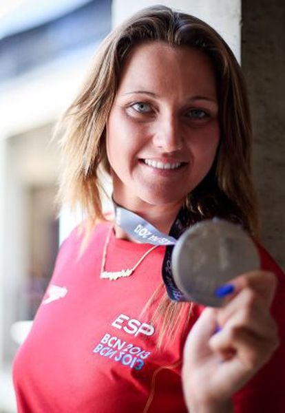 Melani Costa shows off her silver medal.