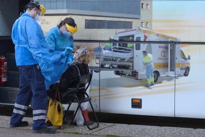 A woman gets tested for coronavirus at a mobile unit in Valladolid on January 4.