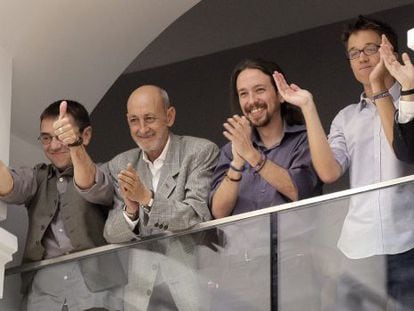Podemos members (from left to right) Juan Carlos Monedero, Jesús Montero, Pablo Iglesias and Íñigo Errejón applaud the investiture of Manuela Carmena.