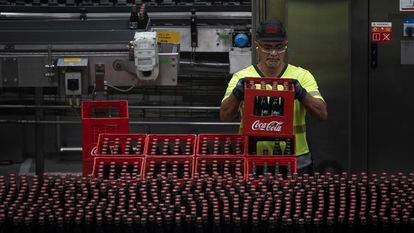 A worker at a Coca-Cola factory in Barcelona.