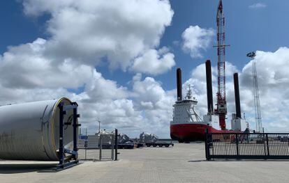 A jackup rig, designed to be able to transport blades and wind turbines, docked in the port of Esbjerg, Denmark. On the left, one of the structures is visible.
