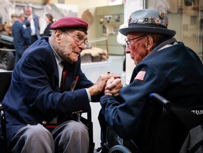 World War II veteran Britain's Bill Gladden, left, speaks with U.S. WWII veteran Jack M. Larson in the Pegasus Bridge memorial in Benouville, Normandy, on June 5, 2023.
