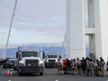 Security force members detain people after demonstrators calling for a ceasefire blocked the Bay Bridge, in San Francisco, California, November 16, 2023.