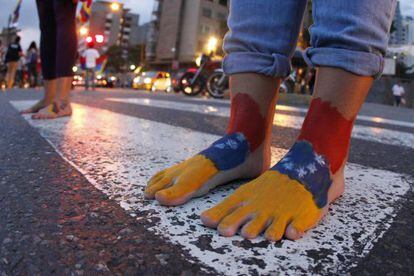 Students march barefoot during a protest in Caracas on Wednesday.