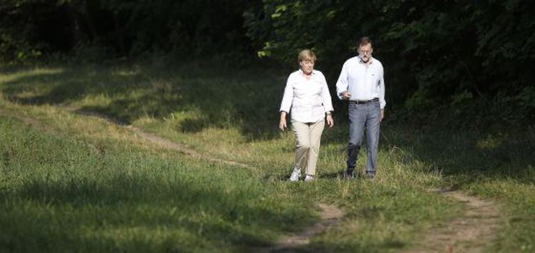 Angela Merkel with Mariano Rajoy in Berlin on Monday.