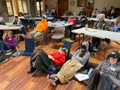 Psilocybin facilitator students sit with eye masks on while listening to music during an experiential activity at a training session run by InnerTrek near Damascus, Ore., on Dec. 2, 2022.
