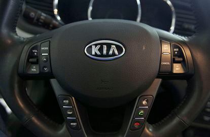The Kia logo brands a steering wheel inside of a Kia car dealership in Elmhurst, Illinois, on October 5, 2012.