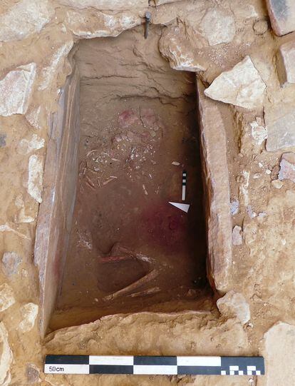  The child’s tomb in Ba'ja, Jordan, with the scattered necklace at the start of the research and recovery work.