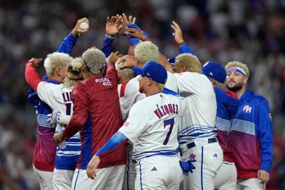 Puerto Rico players celebrate a 10-0 win over Israel with an 8th inning run-rule walk off and a combined perfect game during a World Baseball Classic game, on March 13, 2023, in Miami.