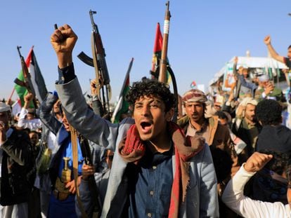 Yemeni demonstrators shout slogans during a protest following U.S. and British strikes, in the Houthi-controlled capital Sana'a on January 12, 2024.