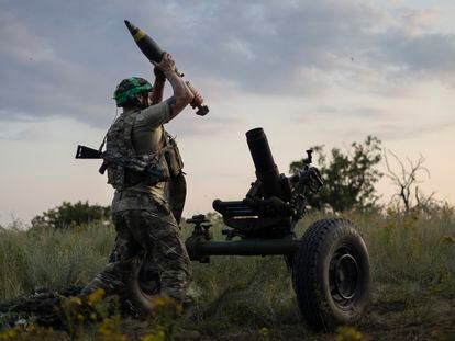 A Ukrainian serviceman of the 3rd Assault Brigade fires a 122mm mortar towards Russian positions at the front line, near Bakhmut, Donetsk region, Ukraine, Sunday, July 2, 2023.