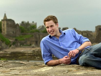 Prince William as a university student, relaxing on the beach on May 28, 2003, in St Andrews, Scotland.