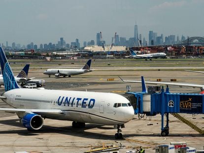 The New York skyline are seen while United Airlines planes use the tarmac at Newark Liberty International Airport in Newark, New Jersey, U.S., May 12, 2023.