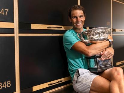 Rafa Nadal embraces the Australian Open trophy.