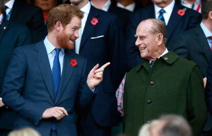 Prince Harry and Philip of Edinburgh at the Rugby World Cup Final in London on October 31, 2015.