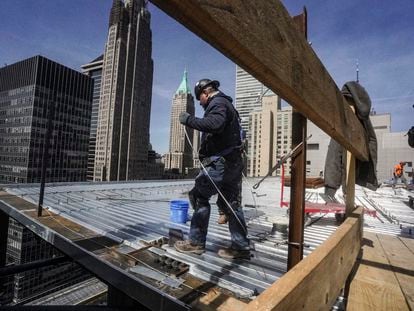 A construction worker on a new building in the financial district of Manhattan, New York, in April 2023.