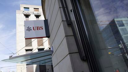 The logos of the Swiss banks UBS and Credit Suisse are displayed on different buildings in Geneva, Switzerland, on March 20, 2023.