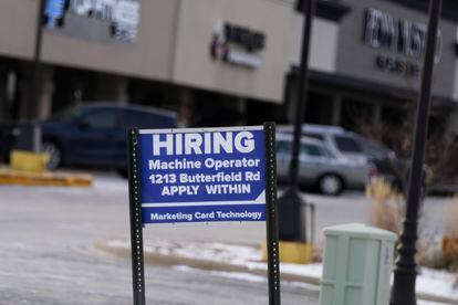 A hiring sign is seen in Downers Grove, Illinois, Thursday, May 5, 2022.