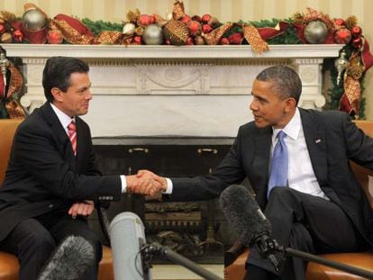 Obama and then President-elect Peña Nieto shake hands during a meeting at the White House in 2012.