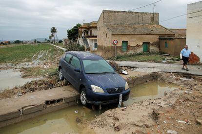 A damaged car on a road in Orihuela, which was isolated for three days due to flooded roads.