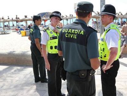 Spanish Civil Guard officers and British policeman on patrol in Magaluf.