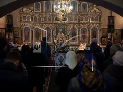 Ukrainians attend a Christmas mass at an Orthodox Church in Bobrytsia, on the outskirts of Kyiv, Ukraine, on Dec. 25, 2022.
