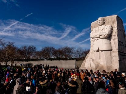 A large group gathers to watch a wreath-laying ceremony at the Martin Luther King Jr. Memorial on Martin Luther King Jr. Day in Washington, Monday, Jan. 16, 2023.