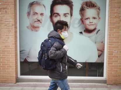 A man wears a protective face mask and gloves in the Spanish city of Pamplona.