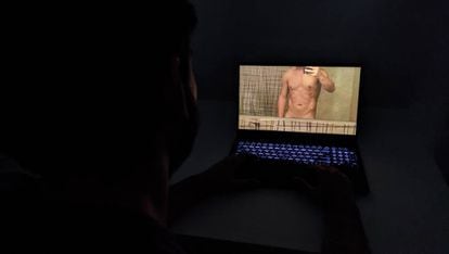 A user views a photograph of a naked man.