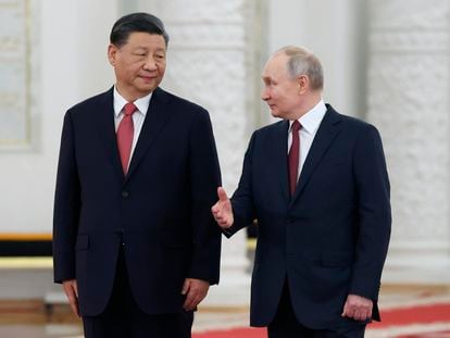 Russian President Vladimir Putin, right, speaks to Chinese President Xi Jinping as they attend an official welcome ceremony at The Grand Kremlin Palace, in Moscow, Russia, March 21, 2023.