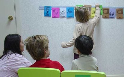 Autistic children learning with pictograms at a special education school in 2009.