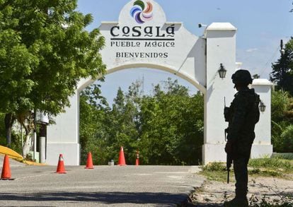 A soldier guards the entrance of a military base outside Cosalá, Sinaloa, Mexico.