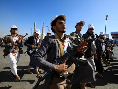 Newly-recruited members of the Houthis' popular army march during a parade in Sana'a, Yemen, December 2, 2023.