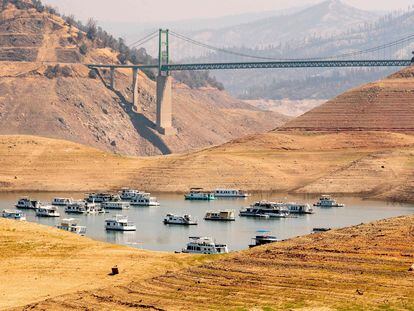 Several boats are concentrated in the deep part of Lake Oroville, in September 2021.